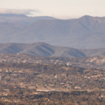 landscape shot of Canberra and surrounding hills.