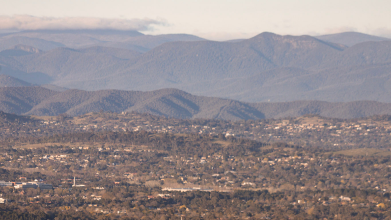 landscape shot of Canberra and surrounding hills.